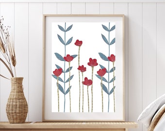 May include: A framed print with a white background and a stylized illustration of red flowers with blue stems and leaves.