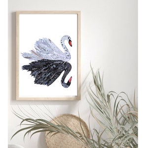 May include: A framed print of a black and white swan made from paper. The swan is in a flying pose with its wings spread out. The background is white.