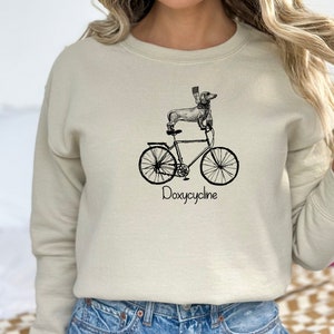 Doxycycline Pharmacy Pun Sweatshirt, Dachshund on Bicycle, Pharmacists Shirt, Veterinary, Pharmacy Gift, Pharmacists & Technicians Gift