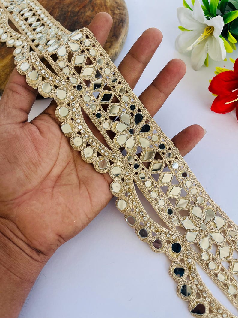 2.75 inch wide scallop mirror trim in gold color featuring intricate Indian embroidery and reflective mirror work, ideal for waist wear jewelry, kamarband designs, lehenga borders, saree edging, blouse decoration, bridal costumes, festive ethnic outfits, dance wear, DIY fashion projects, and traditional Indian garment embellishment with luxury handcrafted finish