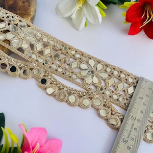 2.75 inch wide scallop mirror trim in gold color featuring intricate Indian embroidery and reflective mirror work, ideal for waist wear jewelry, kamarband designs, lehenga borders, saree edging, blouse decoration, bridal costumes, festive ethnic outfits, dance wear, DIY fashion projects, and traditional Indian garment embellishment with luxury handcrafted finish