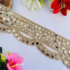 2.75 inch wide scallop mirror trim in gold color featuring intricate Indian embroidery and reflective mirror work, ideal for waist wear jewelry, kamarband designs, lehenga borders, saree edging, blouse decoration, bridal costumes, festive ethnic outfits, dance wear, DIY fashion projects, and traditional Indian garment embellishment with luxury handcrafted finish