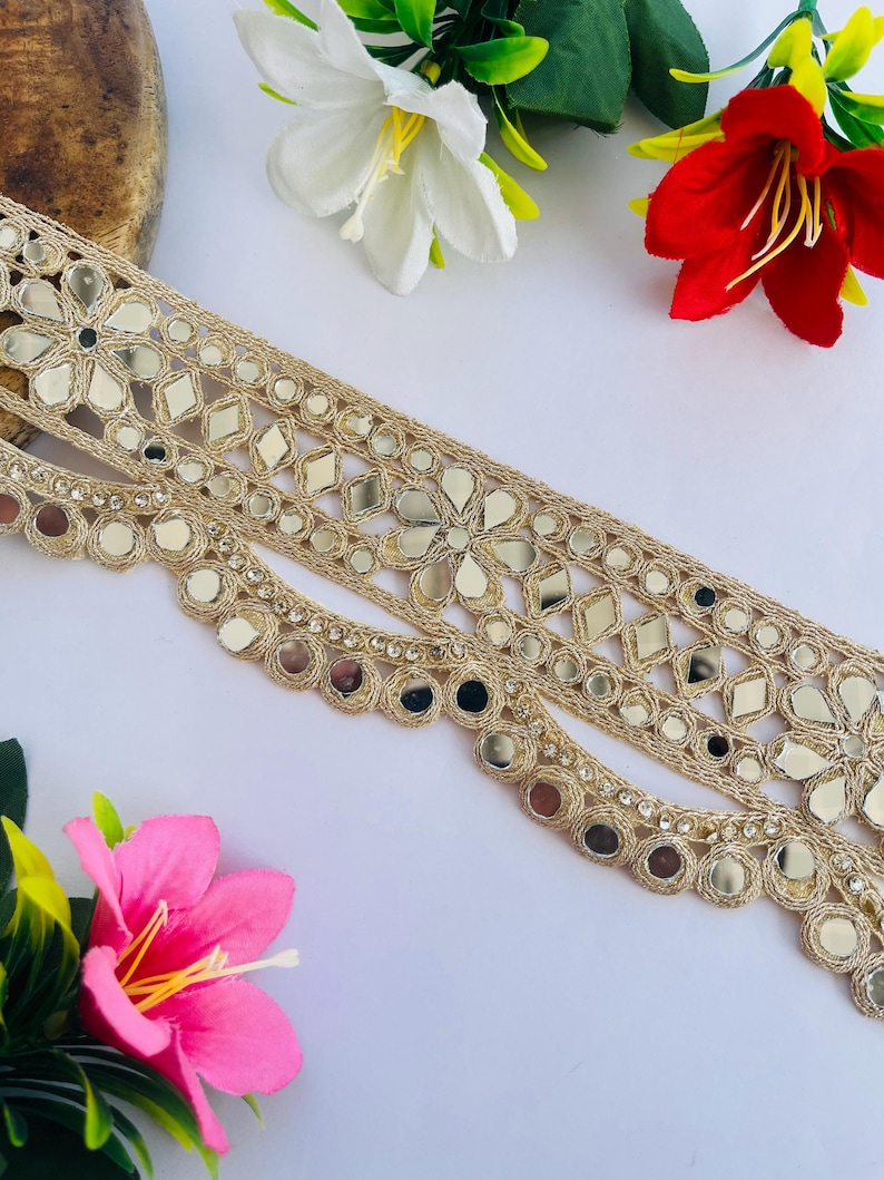 2.75 inch wide scallop mirror trim in gold color featuring intricate Indian embroidery and reflective mirror work, ideal for waist wear jewelry, kamarband designs, lehenga borders, saree edging, blouse decoration, bridal costumes, festive ethnic outfits, dance wear, DIY fashion projects, and traditional Indian garment embellishment with luxury handcrafted finish