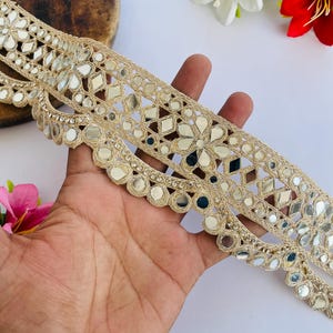 2.75 inch wide scallop mirror trim in gold color featuring intricate Indian embroidery and reflective mirror work, ideal for waist wear jewelry, kamarband designs, lehenga borders, saree edging, blouse decoration, bridal costumes, festive ethnic outfits, dance wear, DIY fashion projects, and traditional Indian garment embellishment with luxury handcrafted finish