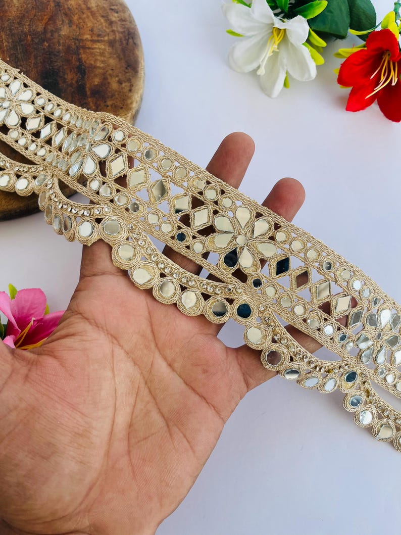 2.75 inch wide scallop mirror trim in gold color featuring intricate Indian embroidery and reflective mirror work, ideal for waist wear jewelry, kamarband designs, lehenga borders, saree edging, blouse decoration, bridal costumes, festive ethnic outfits, dance wear, DIY fashion projects, and traditional Indian garment embellishment with luxury handcrafted finish