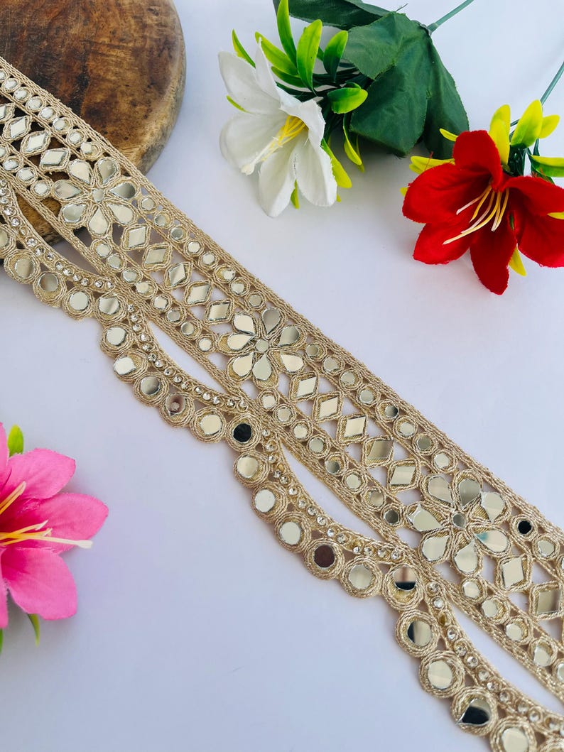 2.75 inch wide scallop mirror trim in gold color featuring intricate Indian embroidery and reflective mirror work, ideal for waist wear jewelry, kamarband designs, lehenga borders, saree edging, blouse decoration, bridal costumes, festive ethnic outfits, dance wear, DIY fashion projects, and traditional Indian garment embellishment with luxury handcrafted finish