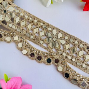 2.75 inch wide scallop mirror trim in gold color featuring intricate Indian embroidery and reflective mirror work, ideal for waist wear jewelry, kamarband designs, lehenga borders, saree edging, blouse decoration, bridal costumes, festive ethnic outfits, dance wear, DIY fashion projects, and traditional Indian garment embellishment with luxury handcrafted finish