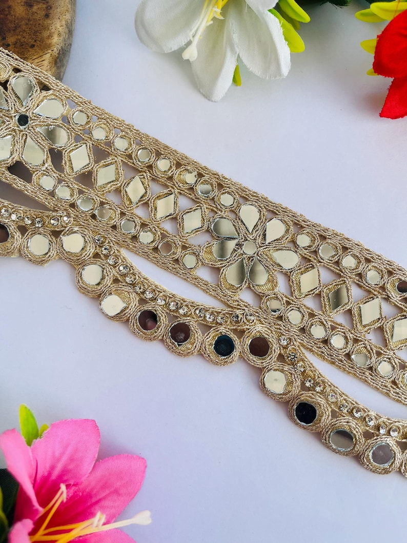 2.75 inch wide scallop mirror trim in gold color featuring intricate Indian embroidery and reflective mirror work, ideal for waist wear jewelry, kamarband designs, lehenga borders, saree edging, blouse decoration, bridal costumes, festive ethnic outfits, dance wear, DIY fashion projects, and traditional Indian garment embellishment with luxury handcrafted finish