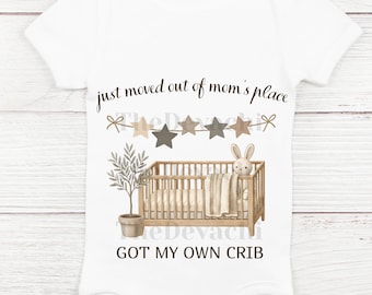 May include: White baby onesie with a graphic of a crib, a bunny, and a potted plant. Text reads "just moved out of mom's place" and "GOT MY OWN CRIB". The design includes a star banner and is in neutral colors.