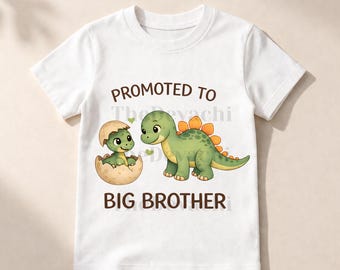 May include: White t-shirt featuring a cartoon dinosaur design. The design includes a green dinosaur, a dinosaur hatching from an egg, and the text "PROMOTED TO BIG BROTHER". The shirt is made of a soft, comfortable material.