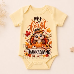 May include: A pale yellow short-sleeved baby bodysuit featuring a graphic print of a cartoon turkey wearing a black hat, sitting in a pumpkin. The text reads My first THANKSGIVING, surrounded by colorful autumn leaves, sunflowers, and berries.