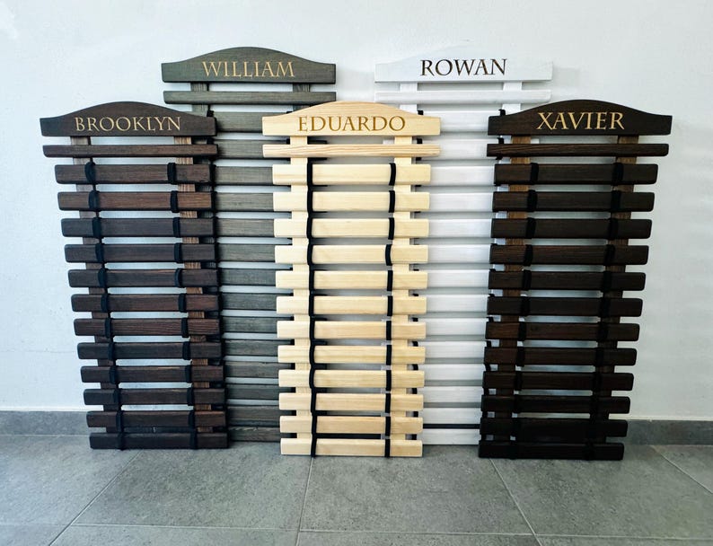 Karate Belt Display Rack Personalized: Martial Arts Belt Holders for Karate, Taekwondo, JiuJitsu and more. Made from High Quality Solid Wood in Natural Wood color, Graphite Gray, White and Palisander (Dark Brown Stain). Permanently engraved with your name.