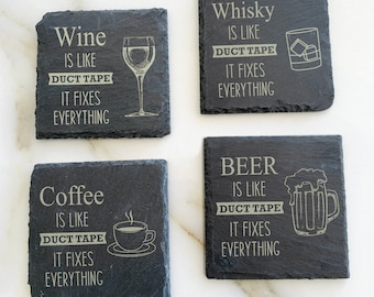 May include: Four black slate coasters with white text and images. The coasters feature the text "Wine is like duct tape, it fixes everything" with a glass of wine, "Whisky is like duct tape, it fixes everything" with a glass of whiskey, "Coffee is like duct tape, it fixes everything" with a cup of coffee, and "Beer is like duct tape, it fixes everything" with a glass of beer.