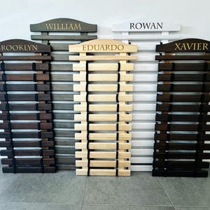 Karate Belt Display Rack Personalized: Martial Arts Belt Holders for Karate, Taekwondo, JiuJitsu and more. Made from High Quality Solid Wood in Natural Wood color, Graphite Gray, White and Palisander (Dark Brown Stain). Permanently engraved with your name.