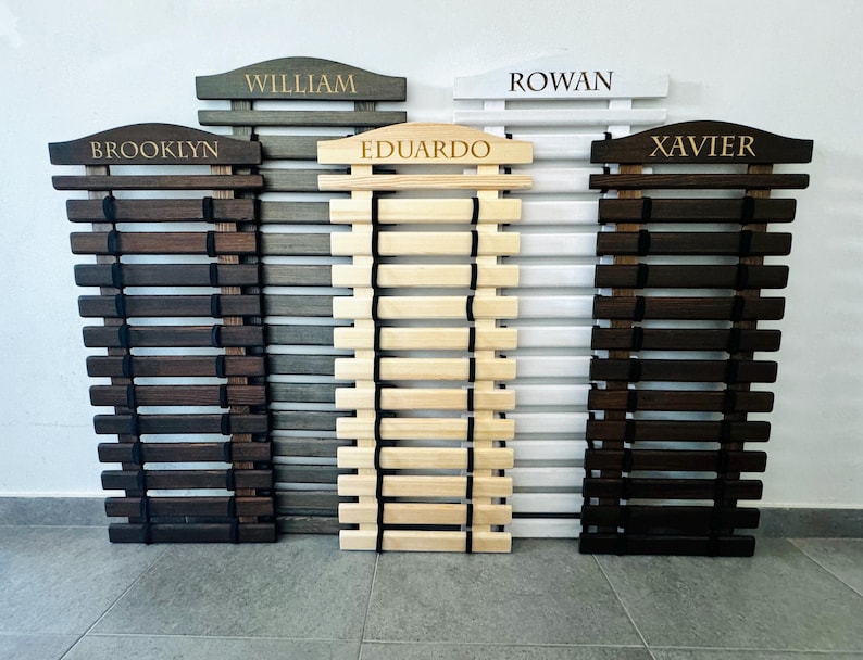 Karate Belt Display Rack Personalized: Martial Arts Belt Holders for Karate, Taekwondo, JiuJitsu and more. Made from High Quality Solid Wood in Natural Wood color, Graphite Gray, White and Palisander (Dark Brown Stain). Permanently engraved with your name.
