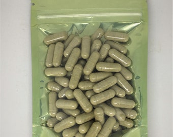 May include: A green resealable pouch filled with a large quantity of beige capsules.