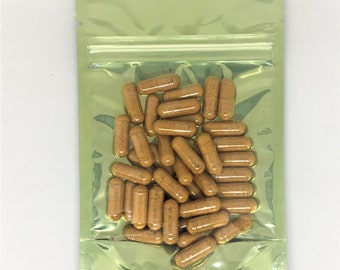 May include: A green resealable pouch filled with a large quantity of brown capsules.