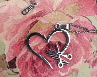 Necklace with a cute heart with scissors & comb inside it.  The perfect gift for stylists and hairdressers. Stainless steel. Unisex jewelry