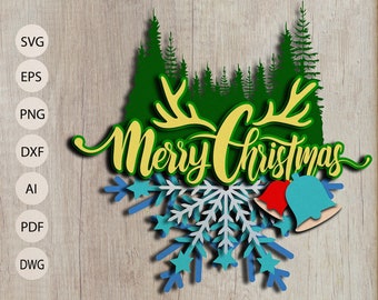May include: A layered Christmas-themed design with the words "Merry Christmas" in yellow script, set against a green forest silhouette and yellow antlers. Below, a blue and white snowflake design with red and blue bells.