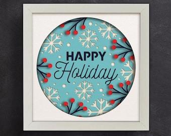 Könnte beinhalten: Ein weißer gerahmter Druck mit einem blauen Kreis, der Schneeflocken, rote Beeren und den Text "HAPPY Holiday" enthält.