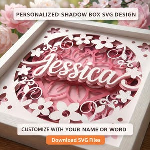 Puede incluir: Una caja de sombra enmarcada en blanco con un diseño floral en capas y el nombre "Jessica" en escritura blanca. El fondo es rosa. Se muestra el texto "PERSONALIZED SHADOW BOX SVG DESIGN" y "CUSTOMIZE WITH YOUR NAME OR WORD".