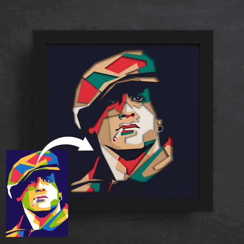 May include: A colorful, geometric portrait of a person wearing a hat and smoking a cigarette. The portrait is made in a paper cut style.