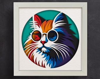 May include: A colorful paper cut-out of a cat wearing round sunglasses. The cat's fur is layered in shades of red, orange, blue, and purple. The background is a teal circle.
