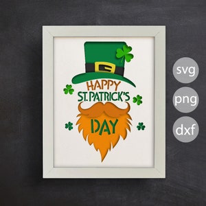 May include: A white frame with a green leprechaun hat, orange beard, and mustache with the text "Happy St. Patrick's Day" inside.
