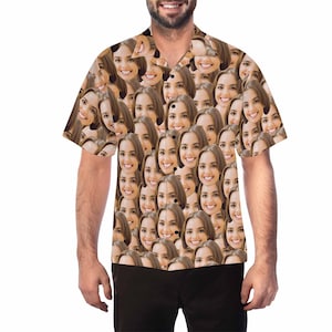 May include: A short-sleeved button-down shirt with a pattern of many faces. The shirt is light brown with a white background.