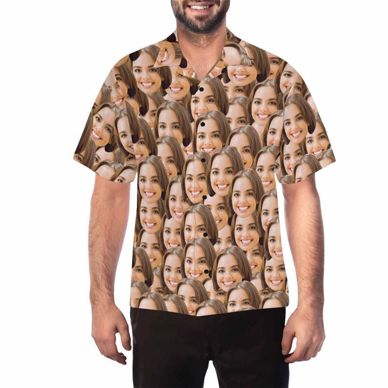 May include: A short-sleeved button-down shirt with a pattern of many faces. The shirt is light brown with a white background.