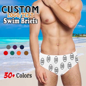 May include: White swim briefs featuring a repeating "Your Logo" design. The text "CUSTOM LOGO/TEXT Swim Briefs" is displayed at the top, with "30+ Colors" at the bottom. A selection of colour options are shown.