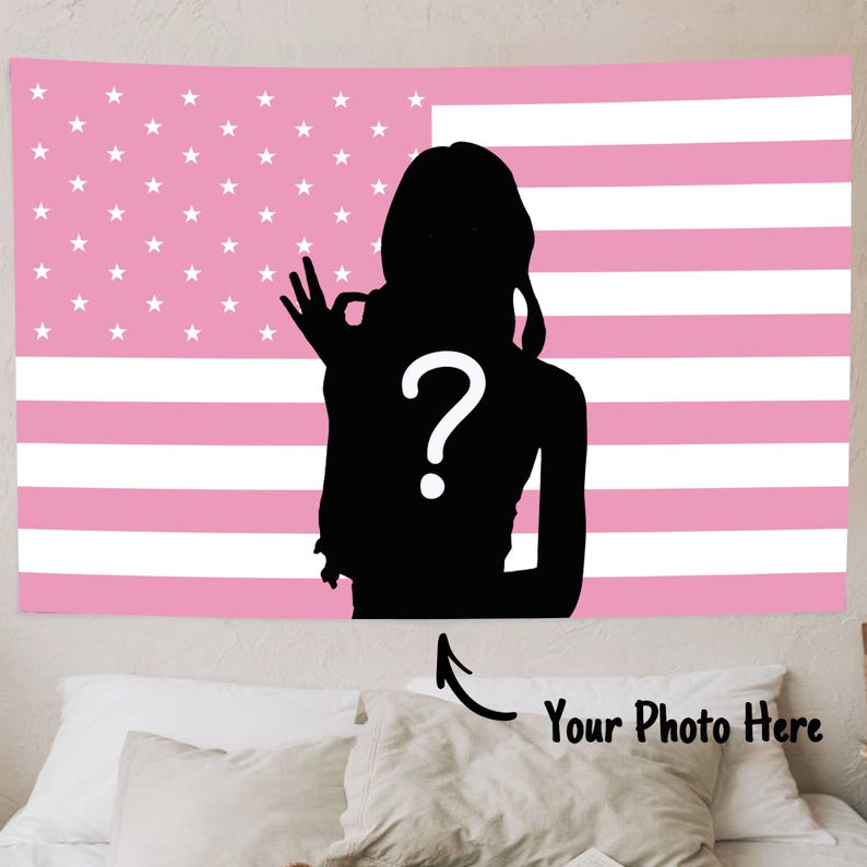 May include: Pink and white American flag tapestry with a black silhouette of a person making an "okay" hand gesture. A white question mark is centered on the silhouette. The text "Your Photo Here" is below the tapestry.