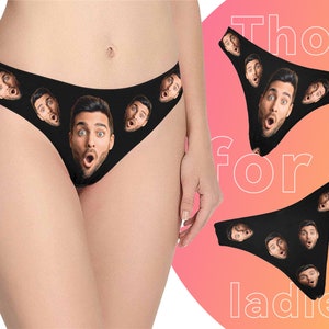 May include: Black underwear with a repeating pattern of men's faces. The text "Thongs for ladies" is visible in the background.