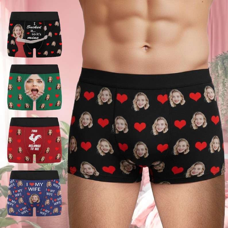 May include: Collection of boxer briefs with various designs. One pair is black with a pattern of faces and red hearts. Other pairs feature faces, text, and graphics. The text includes "I sucked it... so it's mine", "This belongs to me", and "I love my wife".