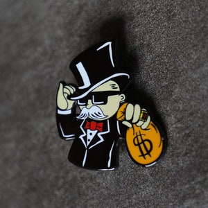 Spilla regalo in smalto duro con il signor Monopoly che tiene in mano un sacco di soldi