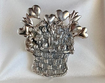 Broche de plata de ley con flores y cesta firmado M.E.