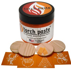 May include: A jar of orange wood burning paste labeled "torch paste" with the tagline "The Original Wood Burning Paste". The jar is surrounded by four wooden circles and four orange stencils with designs of a reindeer, Santa Claus, a Christmas tree, and a snowman.