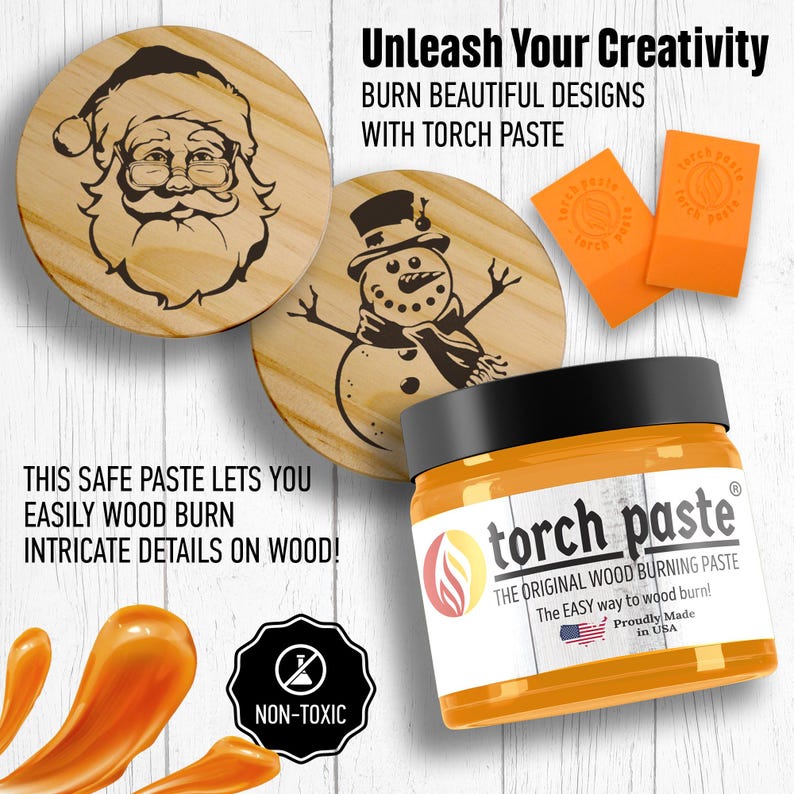 May include: A jar of orange wood burning paste with a label that reads "torch paste" and "The Original Wood Burning Paste". The label also includes the text "The Easy way to wood burn!" and "Proudly Made in USA". The jar is sitting on a white wooden surface with two wooden circles with designs burned into them. One circle has a snowman design and the other has a Santa Claus design. The jar is surrounded by a few drops of orange paste.
