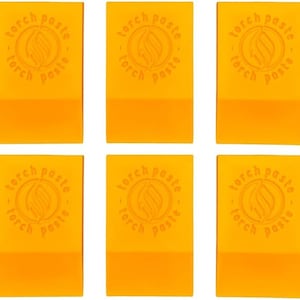 May include: Six orange rectangular blocks with the text "torch paste" and a stylized flame logo repeated on each block.