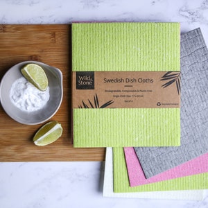 May include: Set of four Swedish dish cloths in green, gray, pink, and white. The cloths are made from biodegradable, compostable, and plastic-free materials. The cloths are 17 x 20 cm in size. The packaging is made from recycled materials.