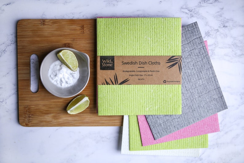 May include: Set of four Swedish dish cloths in green, gray, pink, and white. The cloths are made from biodegradable, compostable, and plastic-free materials. The cloths are 17 x 20 cm in size. The packaging is made from recycled materials.
