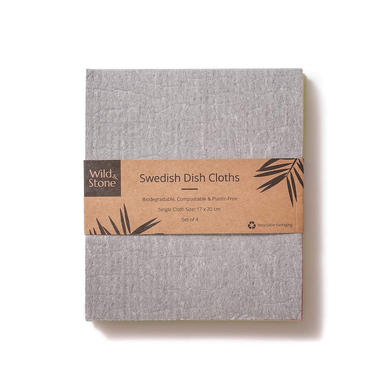 May include: A set of four gray Swedish dish cloths made from biodegradable, compostable, and plastic-free material. The cloths are packaged in a brown cardboard box with a label that reads "Wild & Stone Swedish Dish Cloths" and "Recyclable Packaging". Each cloth measures 17 x 20 inches.