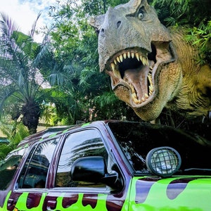 Canvas Print of Jurassic Park Car and T-Rex