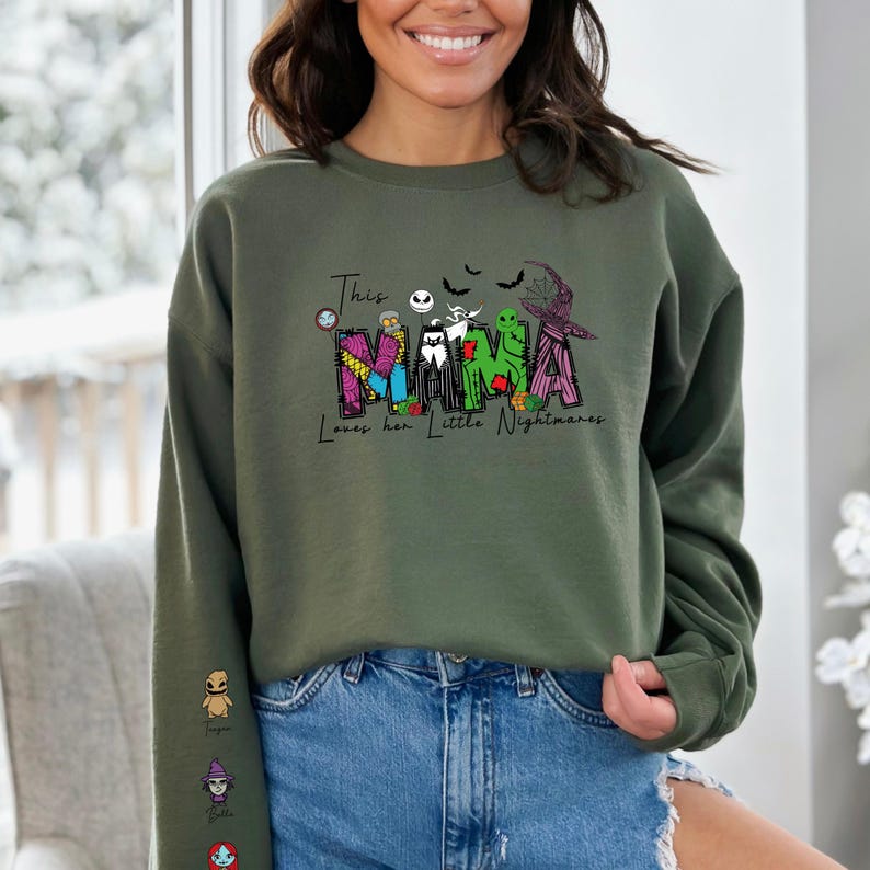 a woman wearing a green sweatshirt with the word mama on it