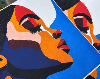 Puede incluir: Dos impresiones artísticas cuadradas que presentan el perfil estilizado de un rostro. La obra utiliza bloques de colores llamativos que incluyen azul brillante, naranja, rojo, negro y blanco. El rostro se muestra de perfil con ojos cerrados.