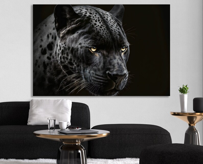 May include: A black and white canvas print featuring a close-up of a black jaguar's face. The jaguar has yellow eyes and a detailed coat pattern. The artwork is set against a dark background, creating a dramatic effect.
