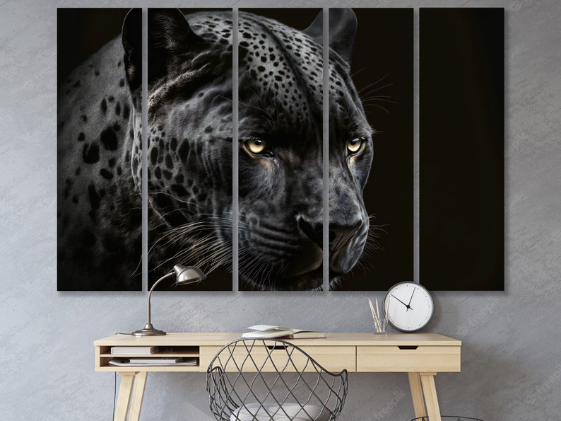 May include: A five-panel canvas art print featuring a close-up of a black panther's face. The panther has yellow eyes and a black coat with dark spots. The artwork is displayed above a wooden desk with a lamp and clock.