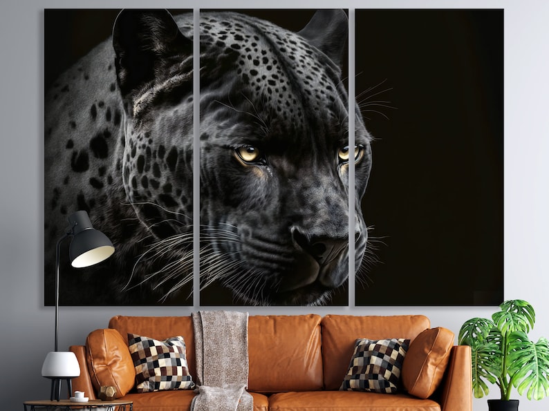 May include: A triptych canvas print featuring a close-up of a black panther's face. The panther's fur is detailed with spots, and its yellow eyes are focused. The artwork is set against a dark background, creating a dramatic effect.
