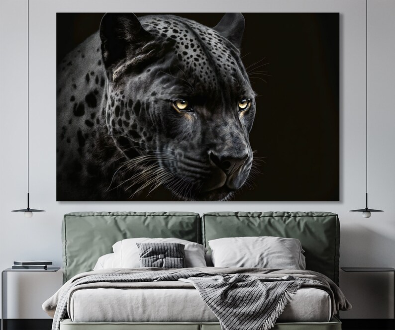 May include: A large canvas print featuring a detailed portrait of a black panther. The panther's face is in sharp focus, with striking yellow eyes and visible whiskers. The artwork is set against a dark background, emphasizing the animal's features.