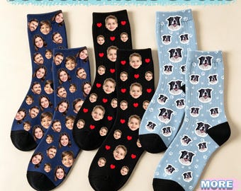 May include: Three pairs of crew socks featuring custom prints. One pair is dark blue with repeating human faces, one is black with repeating human faces and red hearts, and one is light blue with repeating dog faces and white paw prints.